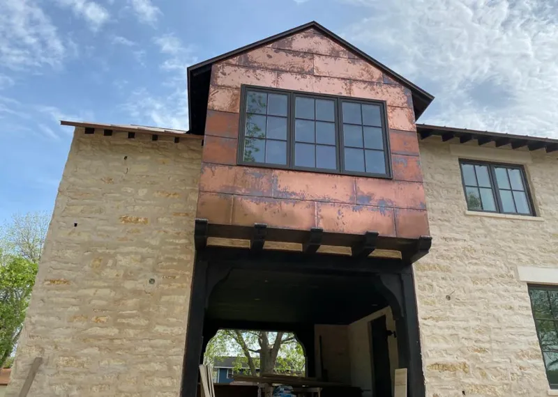 Copper metal panel facade on a stone building for Metal Roof Coating in Nassau Bay