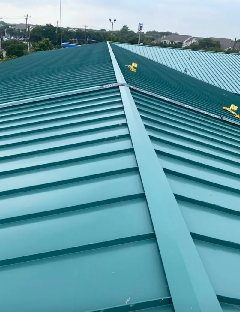 Green commercial metal roof ridge and valley for Metal Roof Repair in Nassau Bay